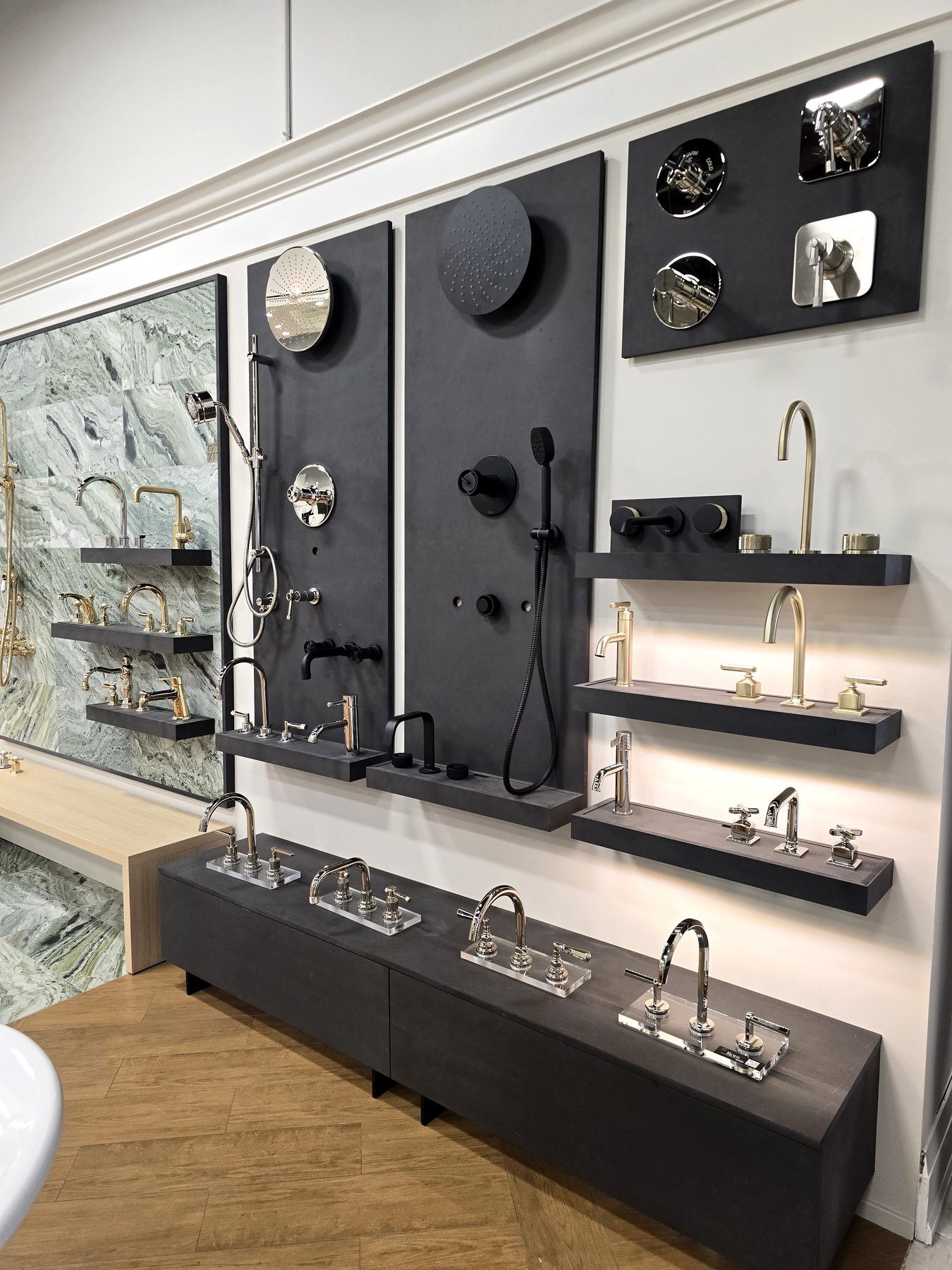 Marble feature wall with black and brass fixtures