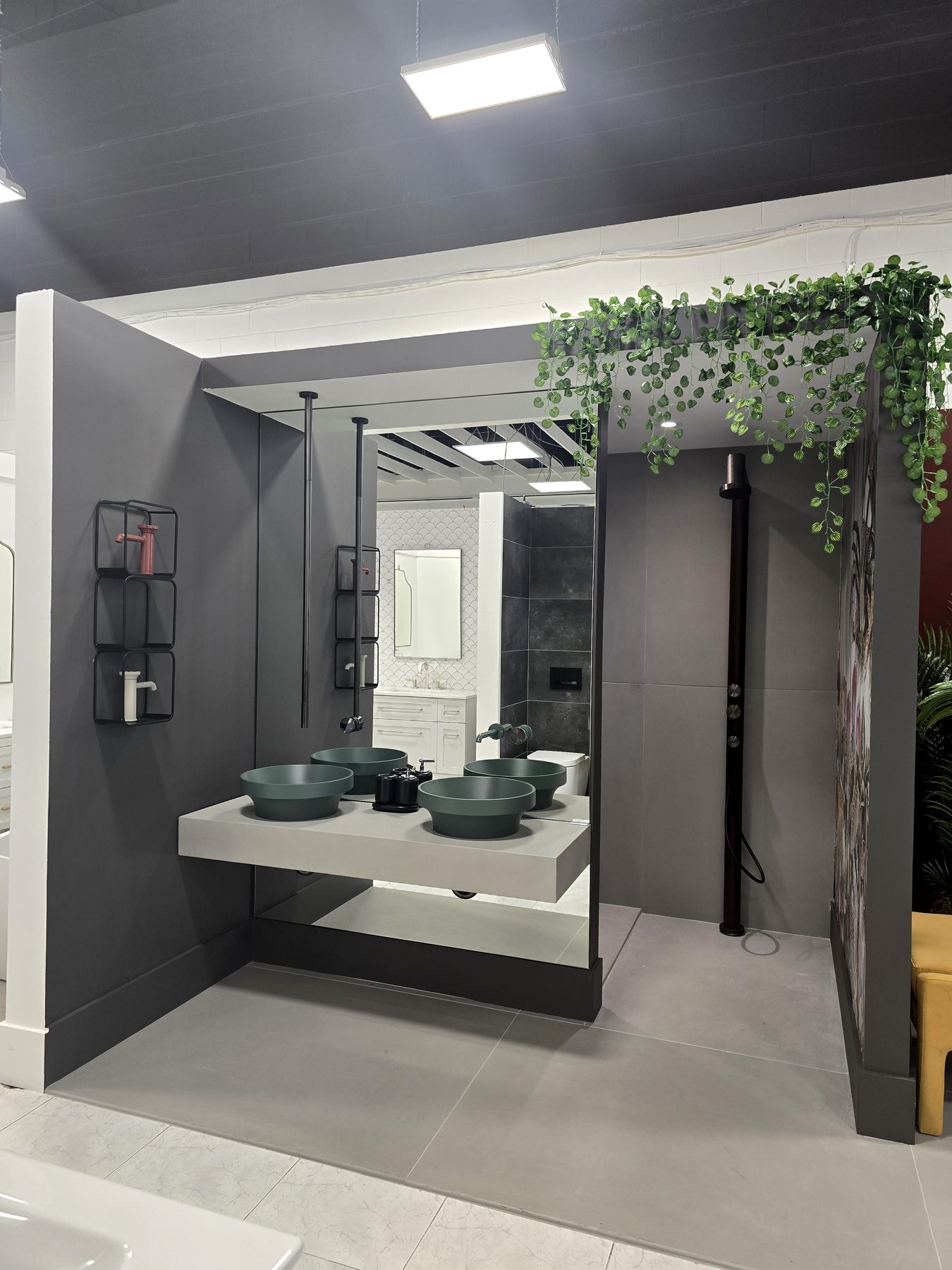 Vanity with green basins and black shelving